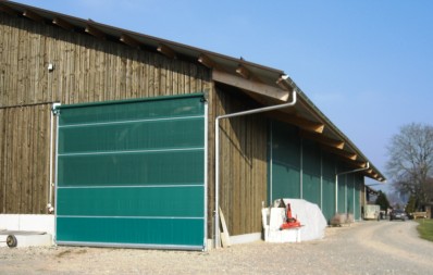 Porte sectionnelle à enroulement pour ouvertures à passages fréquents